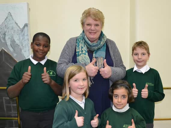 Headteacher Roberta Kirby with pupils from Fernhurst Junior School