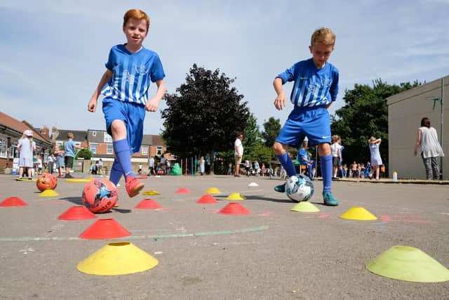 Thomas Brooks (10) and Archie Duff (nine) honing their dribbling skills