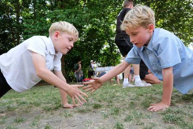 Sid Ball and Gully Bailey, both seven, during a press-up exercise lead by Fullers Fitness