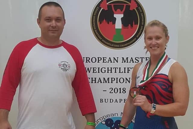Lou Herron, right, finished in third place in the women's age group 35-39, body weight class 69kg. Left: Fareham Barbell Club coach Przemek Borak