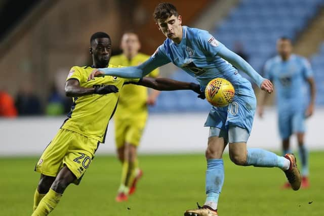 Pompey target Mo Eisa, left, in action against Coventry