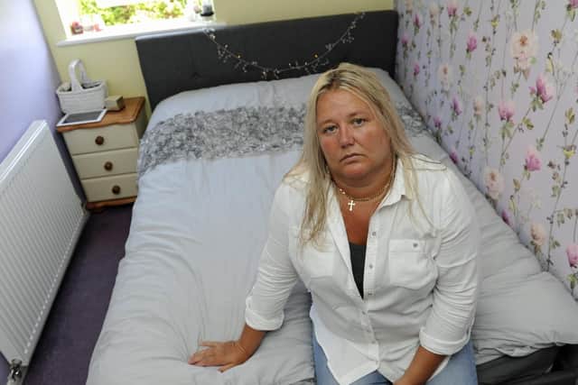 Erica Neave from Gosport sits on the bed she had to buy for her daughter after a replacement from Brighthouse failed to arrive. Picture: Ian Hargreaves (180710-1).