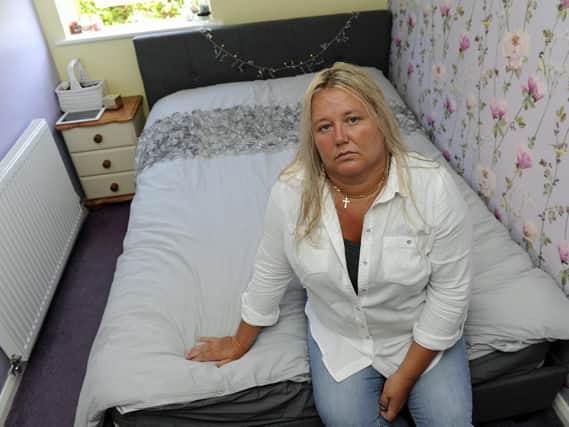 Erica Neave from Gosport sits on the bed she had to buy for her daughter after a replacement from Brighthouse failed to arrive. Picture: Ian Hargreaves (180710-1).