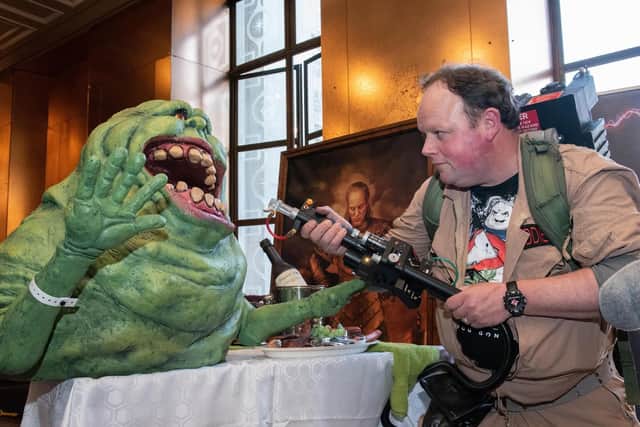Portsmouth Comic Con at The Guildhall - Ghostbuster Lee Kiddie with the Slimer model and Proton Pack Projector he made and displays for charity. Picture: Vernon Nash (180382 -291)