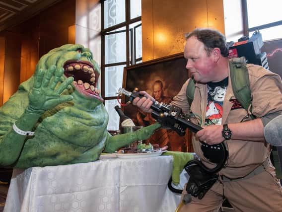 Portsmouth Comic Con at The Guildhall - Ghostbuster Lee Kiddie with the Slimer model and Proton Pack Projector he made and displays for charity. Picture: Vernon Nash (180382 -291)