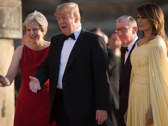US President Donald Trump and his wife Melania are welcomed by Prime Minister Theresa May and her husband Philip May at Blenheim Palace, Oxfordshire. Picture: Stefan Rousseau/PA Wire