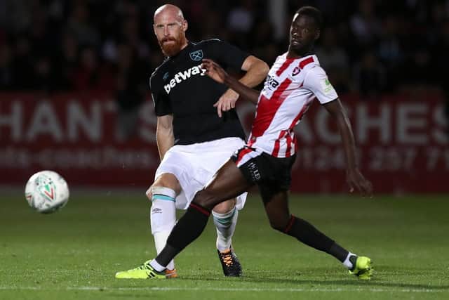 Cheltenham striker Mo Eisa, right