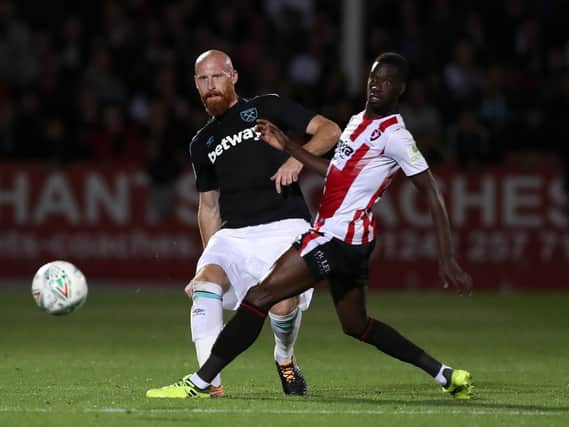 Cheltenham striker Mo Eisa, right