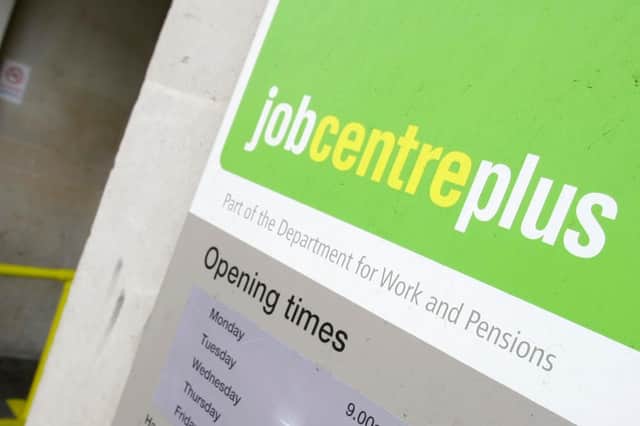 A person entering a job centre. Picture: AP Photo/Alastair Grant