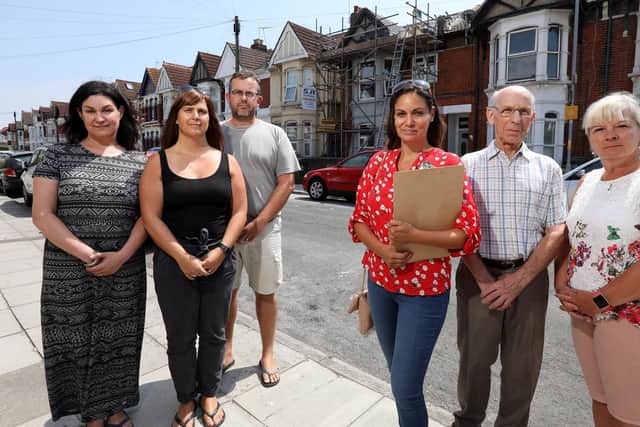 From left, Jeanette Mudd, Clare and Ben George, Rachel Lowe, Roy Herbert and Steph Callaway outside 37 Wadham Road. Picture: Chris Moorhouse
