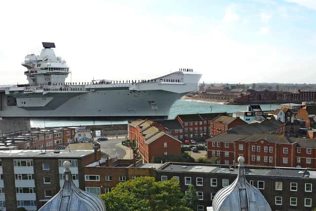 HMS Queen Elizabeth superimposed entering Portsmouth Harbour 2017.