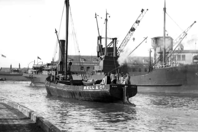 With a collier tied up alongside the Camber dock we see a steam vessel making her way out to the harbour. Picture: Barry Cox Collection