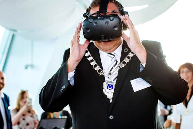 The Lord Deputy Mayor of Portsmouth Councillor David Fueller gives the VR headset a whirl. Picture: Helen Yates