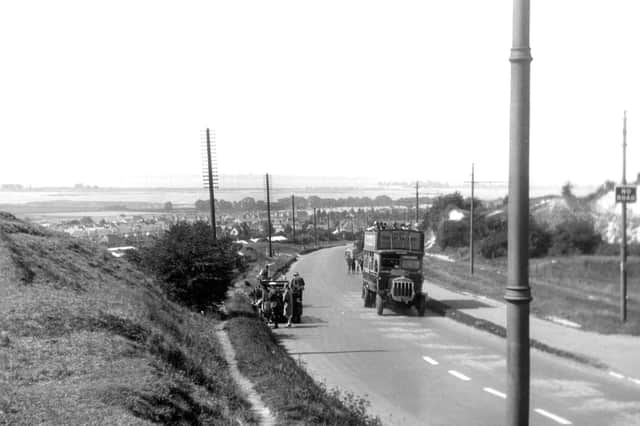 Broken down on the hill. A different angle to Tuesdays photograph and we can see the RAC/AA man attending the car on the left. Picture: Barry Cox Collection