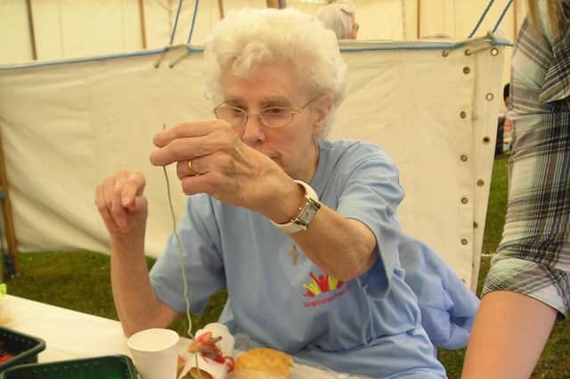 Ellen Cole makes edible jewellery for children at a previous Langstone Church event