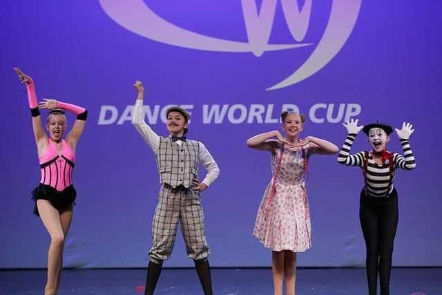 Marie Clarke School of Dance, in Southsea, had 19 members compete in the Dance World Cup in Barcelona. Pictured is Libby Jerome (11), Olivia Gatrell (11), Ruby Doe (12), Lola Ash (12) who won bronze in the children's song small group section. Picture: Club Wow