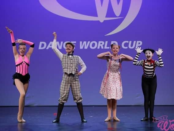 Marie Clarke School of Dance, in Southsea, had 19 members compete in the Dance World Cup in Barcelona. Pictured is Libby Jerome (11), Olivia Gatrell (11), Ruby Doe (12), Lola Ash (12) who won bronze in the children's song small group section. Picture: Club Wow