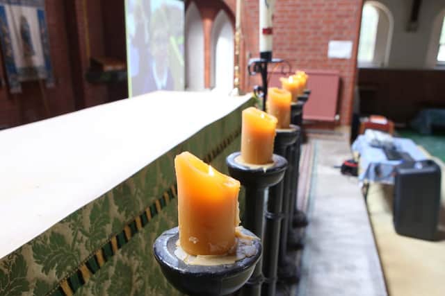 Candles were lit inside the church for Leo Burton's funeral. Picture: Habibur Rahman