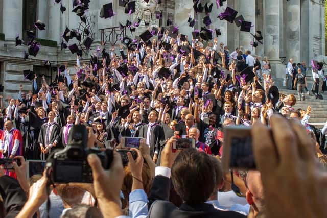 Graduates throw their mortar boards in the air during a University of Portsmouth graduation ceremony at The Guildhall, Portsmouth.
Photo: Melanie Leininger.