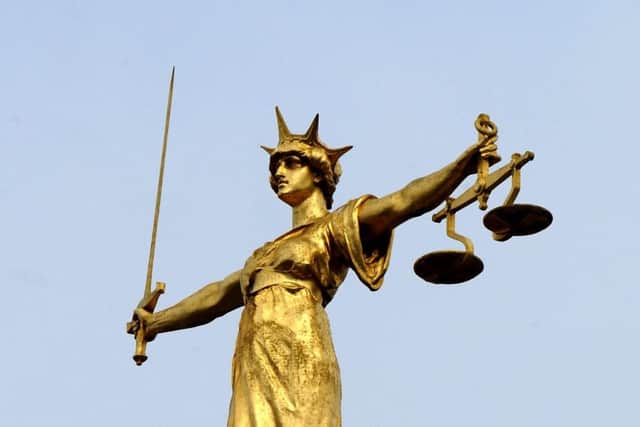 The famous statue of Lady Justice. Ian Nicholson/PA Wire SUS-170112-120259001