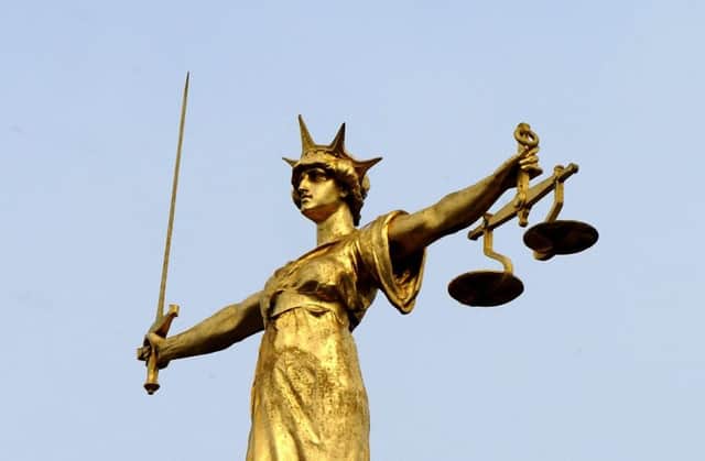 The famous statue of Lady Justice. Ian Nicholson/PA Wire SUS-170112-120259001