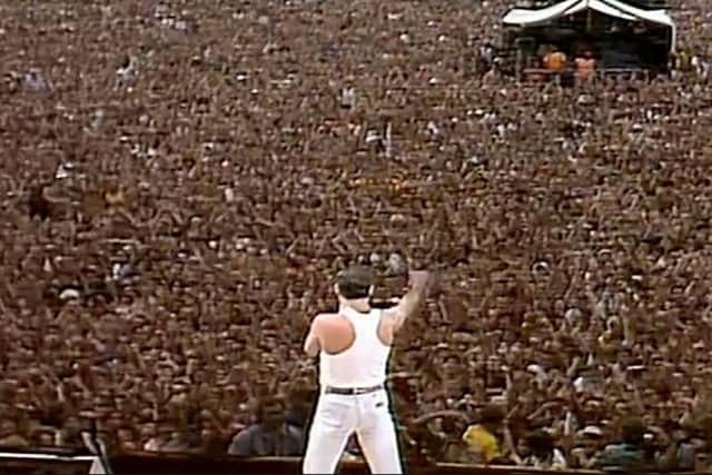 Freddie Mercury working the masses at Live Aid.