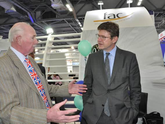 Tony Barnett from Barnbrook Systems and a director of Farnborough Aerospace (FAC) speaks to Government Minister Greg Clark