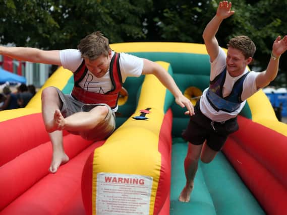 The Gibson brothers, Luke, left, and George, on the bungee run. Picture: Chris Moorhouse