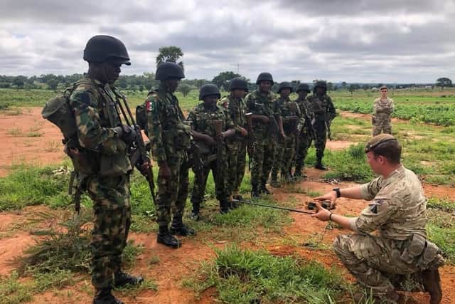 A member of 2PWRR teaching Nigerian soldiers about how to deal with an improvised explosive device (IED). Photo: 2PWRR