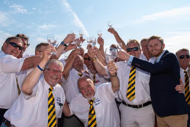The 4-2-8 Gin Club members raise their glasses of Watenshi Gin to the sky with Cambridge Distillery Commercial Manager Robin Warren-Adamson.  Picture: Vernon Nash