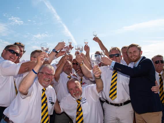 The 4-2-8 Gin Club members raise their glasses of Watenshi Gin to the sky with Cambridge Distillery Commercial Manager Robin Warren-Adamson.  Picture: Vernon Nash