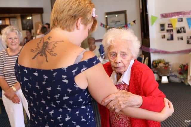 Charlie Elkins dancing with  great-grandmother Marge Dunaway on her 100th birthday