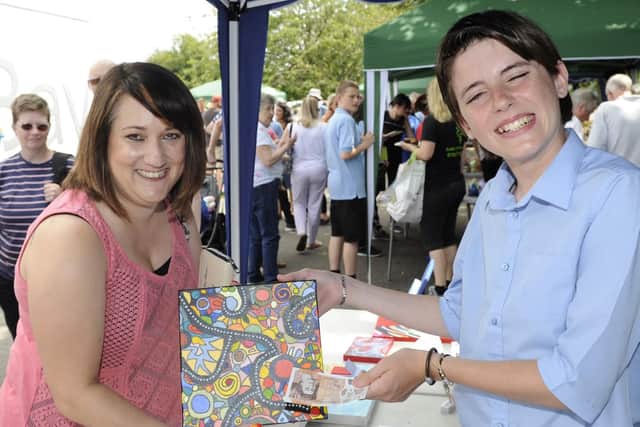 Emily Thomas from Southsea, left,  is served by Shay Burke, 14
Picture: Ian Hargreaves  (180712-1_baycroft)