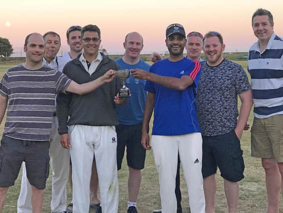VICTORY: Members of Portsmouth Property Association relish victory over Southampton Property Association in the annual cricket fixture, held at St Helens Fields, Southsea.