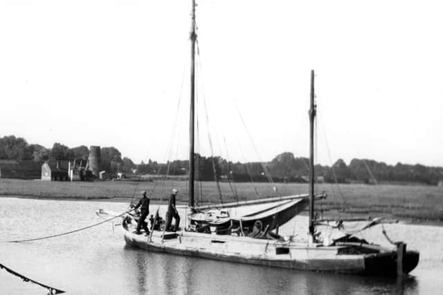 A barge in Langstone Harbour. The old mill is in the background.
Picture: Barry Cox Collection