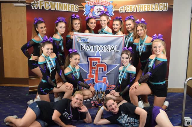 Cheer-a-cality with their trophy Picture: Lara Hallam