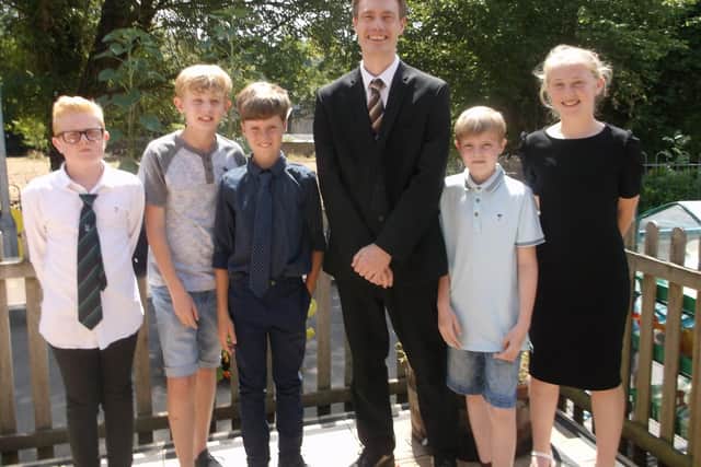 Headteacher Paul Davies alongside Year 6 pupils of Hambledon Primary School