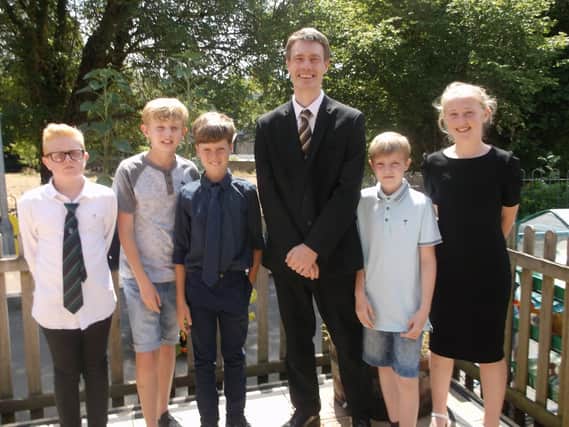 Headteacher Paul Davies alongside Year 6 pupils of Hambledon Primary School