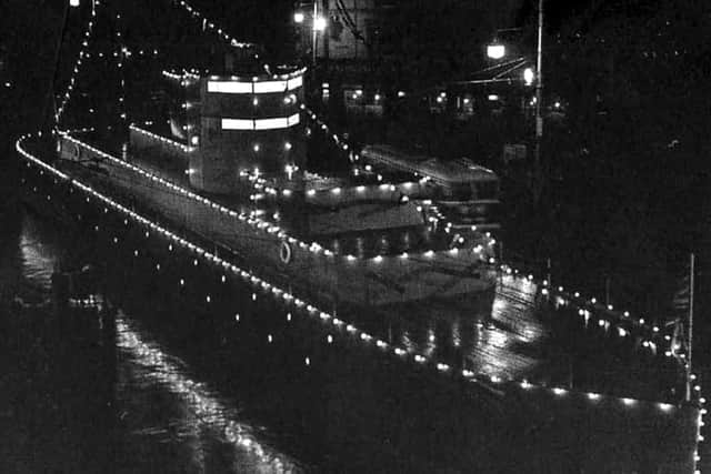 The Coronation all lit up. A passing trolleybus gives it some scale.