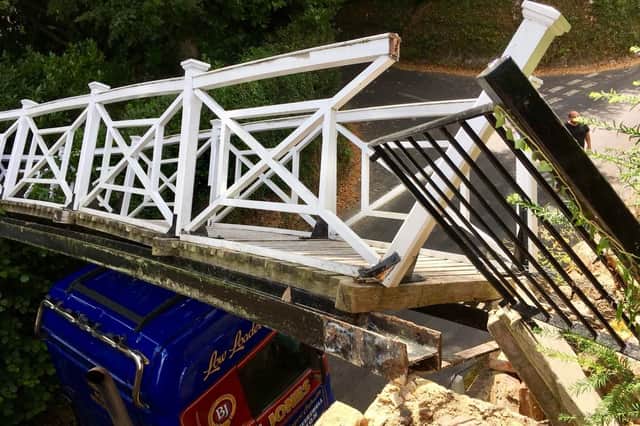 They hay lorry crashed into the Grade 2 listed bridge at Jenkyns Place Vineyard. Picture: Solent News & Photo Agency