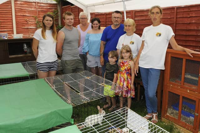 Vanessa Taylor with her friends and fellow members of South Coast Rabbit Rescue based in Paulsgrove, Portsmouth, Hampshire saved 22 rabbits from a single property earlier this week - this has now risen to 28 due to six newborns overnight! Vanessa now has 51 rabbits either abandoned or lost in her possession and has run out of space to take any more Picture: Malcolm Wells (180727-8942)
