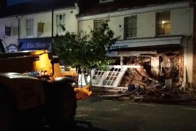 The JCB and the front of the raided bank. Picture: Buckinghamshire & Milton Keynes Fire & Rescue Service