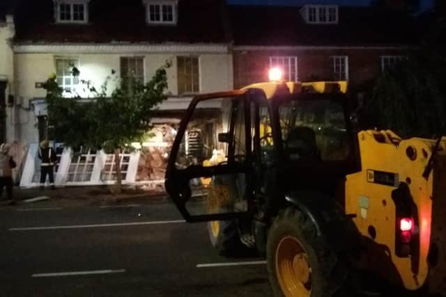 The JCB which forced entry into the bank. Picture: Buckinghamshire & Milton Keynes Fire & Rescue Service/PA