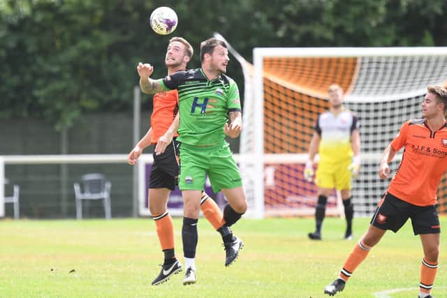 Craig McAllister, green, has his work cut out at Gosport Borough. Picture: Neil Marshall