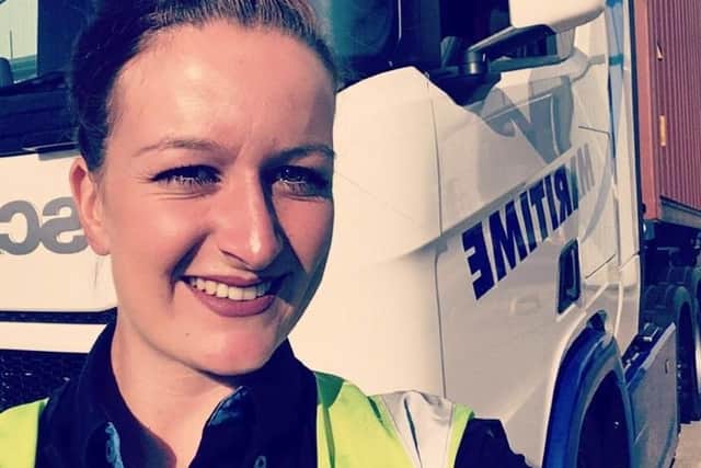 Katie Pycroft alongside her 44 tonne truck