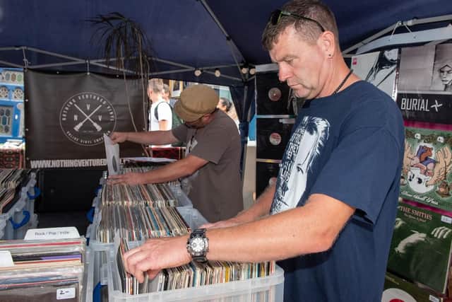 The Summer Fayre held at Castle Road in Southsea - Looking through LPs at Alex Cave's record stall. Picture: Vernon Nash (180410-003)