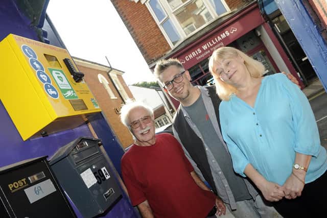 Residents have paid for a new defibrillator which has been installed on the wall of a shop in Castle Road, Southsea. (left to right), Paul Lombardi, shop owner Clive Padfield and Paul's wife, Marilyn.