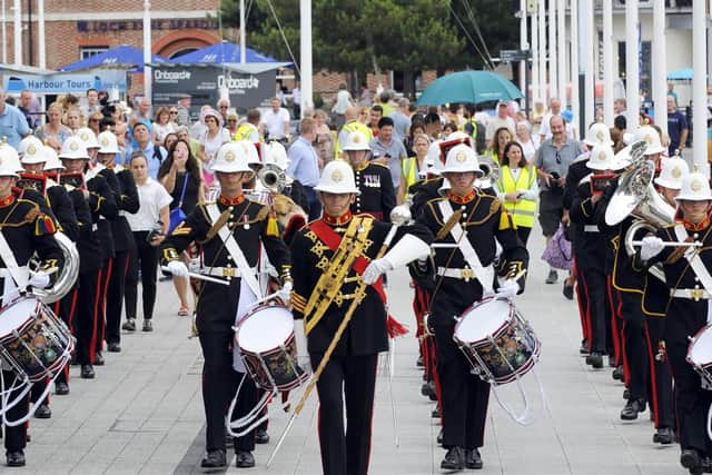 The Royal Marines School of Music treated shoppers at Gunwharf Quays in Portsmouth, Hampshire on Friday afternoon to a free performance. Picture: Malcolm Wells.
