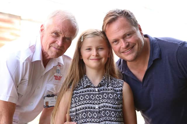 Livvy's grandad Richard Coates, Livvy, aged 8, and her dad Mark Coates Picture: Habibur Rahman