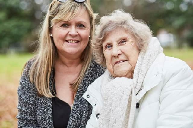 Sam Evans with her mum Dotty Harman. Sam, 53 from Portsmouth, is taking part in Alzheimer's Society's Portsmouth Memory Walk in October. Dotty was diagnosed with dementia seven years ago. Picture: Alzheimer's Society/Lucy Pope